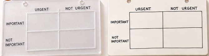 Two planning boards with an urgent and important matrix: one clear acrylic, one whiteboard.
